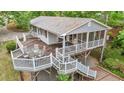 Lovely elevated deck with dining table and chairs plus outdoor seating at 104 Pontiac Cv, Louisburg, NC 27549