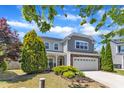 Lovely home with manicured lawn and mature evergreens, offering a welcoming and picturesque view at 120 Cobblebrook Ct, Holly Springs, NC 27540