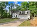 Charming two-story home with dormers and attached two car garage at 1609 Falls Ct, Raleigh, NC 27615