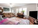 Cozy living room with comfortable seating, piano, and ample natural light at 168 Hoss Ridge Ln, Dunn, NC 28334