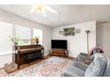 Spacious living room with plush seating, entertainment center, and large windows at 168 Hoss Ridge Ln, Dunn, NC 28334
