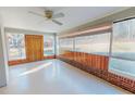 Bright sunroom with lots of windows and a ceiling fan at 178 Medford Oakley Rd, Rougemont, NC 27572