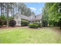 Attractive home showcasing well-maintained landscaping, green grass, and a classic facade at 25 Williamston Ridge Dr, Youngsville, NC 27596