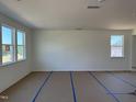 Spacious living room with large windows providing ample natural light at 2628 Pivot Ridge Dr, Raleigh, NC 27616
