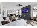 Bright living room featuring a fireplace, hardwood floors, and an open floor plan at 270 Wendover Pkwy, Pittsboro, NC 27312