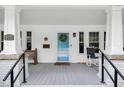 Charming front porch with rocking chair, decorative door, and classic architectural details at 310 Henderson St, Oxford, NC 27565