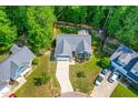 Aerial view of a single-story home with driveway and fenced backyard at 33 Carrington Cir, Angier, NC 27501