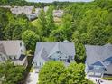 Aerial view of home showcasing the well-maintained roof and verdant surroundings at 415 Waverly Hills Dr, Cary, NC 27519