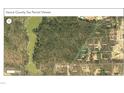 A detailed parcel map showing the property's location in a wooded area near a community at 420 Spring Ln, Henderson, NC 27537