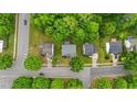 Aerial view of a neighborhood featuring well-maintained homes and lush greenery at 468 Hay River St, Garner, NC 27529