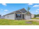 Well-maintained single-Gathering home with gray siding, a two-car garage, and a tidy front yard at 514 Lochalsh Dr, Gibsonville, NC 27249