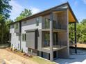 Contemporary home featuring multi-level decks, modern siding and professional landscaping at 528 1/2 Bragg St, Raleigh, NC 27610