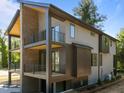 Contemporary home featuring multi-level decks, modern siding and professional landscaping at 528 1/2 Bragg St, Raleigh, NC 27610