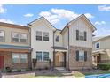 Beautiful townhome with stone accents, complemented by manicured landscaping and a welcoming entrance at 709 Wickham Ridge Rd, Apex, NC 27539