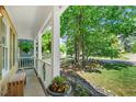 Welcoming front porch with white columns and a view of the landscaped front yard at 11 Bridgeport Dr, Durham, NC 27713