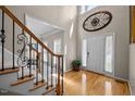 Elegant foyer with hardwood floors, high ceilings, and decorative wall art at 11 Smoketree Ct, Durham, NC 27712