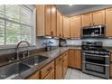 Well-equipped kitchen with modern appliances, ample cabinet space, and stone countertops at 11 Smoketree Ct, Durham, NC 27712