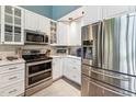 Updated kitchen featuring stainless steel appliances and white cabinetry at 11477 Club Dr, Chapel Hill, NC 27517