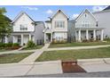 Charming two-story home with neutral siding, a welcoming porch, and well-manicured landscaping at 1641 Glazebrook Dr, Wake Forest, NC 27587