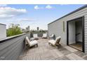Rooftop deck with comfortable seating offering an expansive city view at 221 Woodsborough Pl, Raleigh, NC 27601