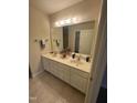 Bathroom with double sink vanity with a large mirror at 2520-102 Gordon Glen Ct, Raleigh, NC 27617