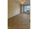 Cozy bedroom featuring plush carpeting and a ceiling fan at 2520-102 Gordon Glen Ct, Raleigh, NC 27617