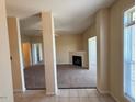 View of the living room featuring neutral tones and access to a fireplace at 2521 Friedland Pl # 301, Raleigh, NC 27617