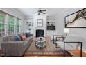 Inviting living room featuring a cozy fireplace, built-in shelving, and ample natural light at 2728 Cameron Pond Dr, Cary, NC 27519