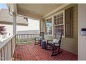 Relaxing front porch featuring rocking chairs and a view of the neighborhood at 2728 Cameron Pond Dr, Cary, NC 27519