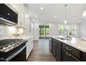 Modern kitchen with stainless steel appliances and access to outdoor living space for easy entertaining at 425 Shadow Falls Dr, Wendell, NC 27591