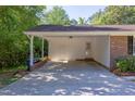Spacious carport attached to the home, offering covered parking and additional storage space at 4300 Edgehill Ct, Raleigh, NC 27612