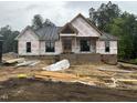 New construction home with wood framing and visible roof and window openings at 5021 Mitchell Town Rd, Youngsville, NC 27596