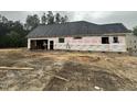 Exterior view of a house under construction with visible framing and sheathing materials at 5021 Mitchell Town Rd, Youngsville, NC 27596