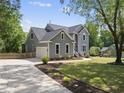 Beautiful home with attached garage, gray siding, and well-manicured landscaping at 7116 Incline Dr, Wake Forest, NC 27587