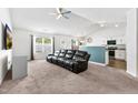 Inviting living room with neutral tones and a modern ceiling fan for added comfort at 1004 Gold Cir, Mebane, NC 27302