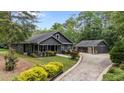 Spacious home with a detached garage and landscaped yard, set on a generous lot at 109 Rustler Rd, Louisburg, NC 27549