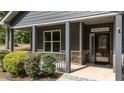 Inviting front porch with stone accents, leading to the entrance of the home at 109 Rustler Rd, Louisburg, NC 27549
