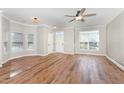 Bright living room with hardwood floors, crown molding, and ample natural light at 11700 Coppergate Dr # 100, Raleigh, NC 27614