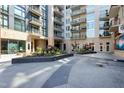 Beautiful common courtyard with a patio, landscaping, seating and other decorative features at 140 W Franklin St # 706, Chapel Hill, NC 27516