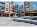 Exterior shot looking at the courtyard with outdoor seating between the buildings at 140 W Franklin St # 706, Chapel Hill, NC 27516