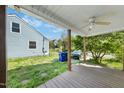 A spacious backyard features a covered patio and a lush lawn, ideal for outdoor activities at 214 Northwood Cir, Durham, NC 27701