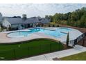 Aerial view of the community pool with a recreational pool, lap pool, and seating areas at 2301 Bay Minette Sta # 538, Apex, NC 27502