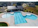 An aerial view of the community pool with lap lanes, a splash area, and a covered seating area at 2301 Bay Minette Sta # 538, Apex, NC 27502
