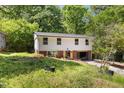 Two-story home with green lawn, red brick base, and an asphalt driveway at 2904 Sprucewood Dr, Durham, NC 27707