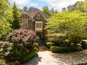 A charming two-story brick home with a neatly landscaped yard and symmetrical design at 3203 Rugby Rd, Durham, NC 27707
