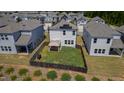 Backyard aerial view showcasing a gazebo, grill, and a wooden privacy fence at 33 White Ash Dr, Clayton, NC 27527
