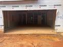 Unfinished two-car garage with concrete floor and visible framing, part of a new construction home at 436 Golden Dragonfly St, Wake Forest, NC 27587