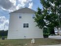 Side view of home, showcasing the property's well-maintained siding and clean lines at 4910 Briarstone Ct, Raleigh, NC 27610