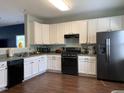 Kitchen with stainless appliances, ample counter space, and plenty of storage at 4910 Briarstone Ct, Raleigh, NC 27610