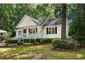 Charming one-story home with white siding and a landscaped yard at 5414 Stanley Rd, Durham, NC 27704